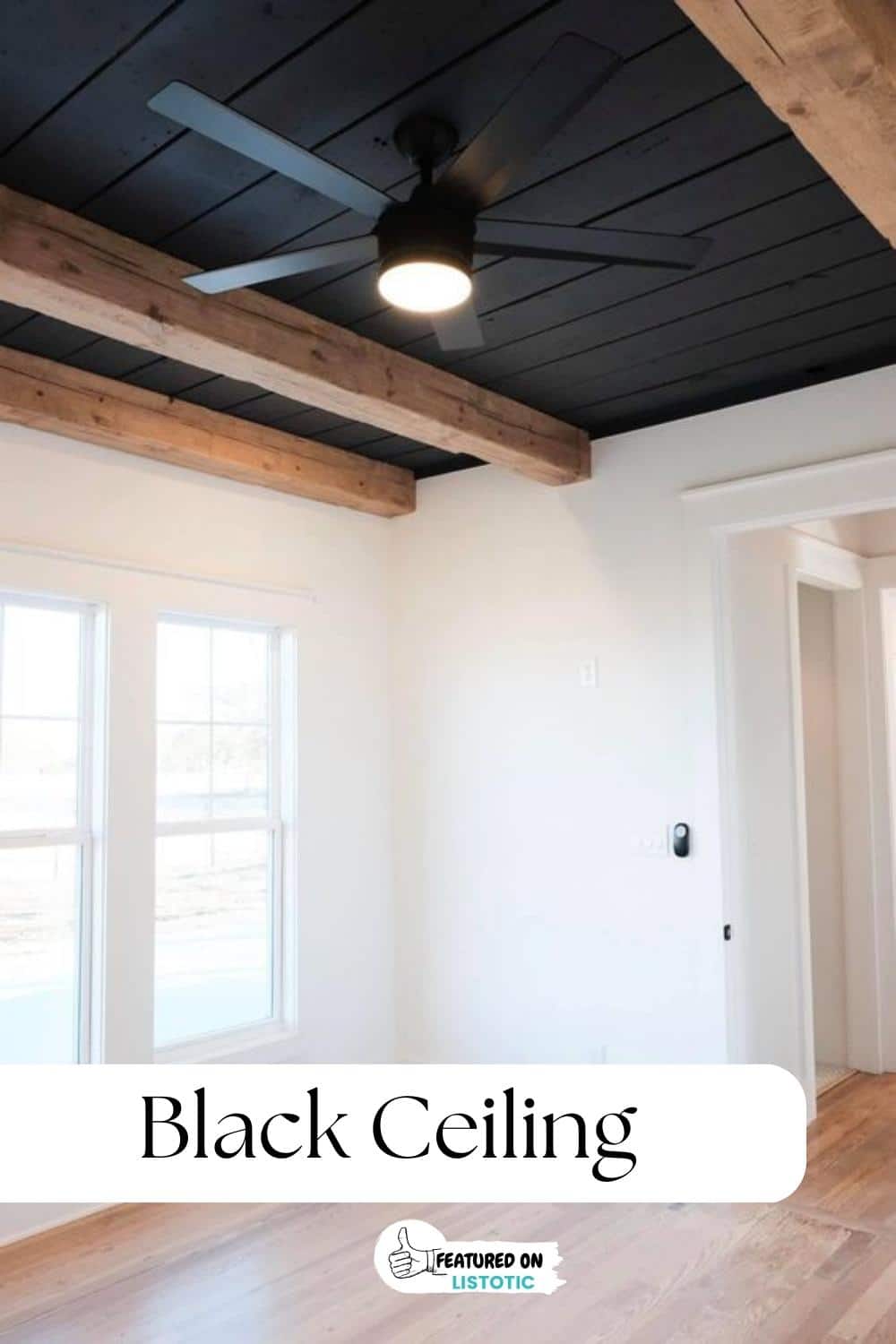 black tray ceiling with wood beams