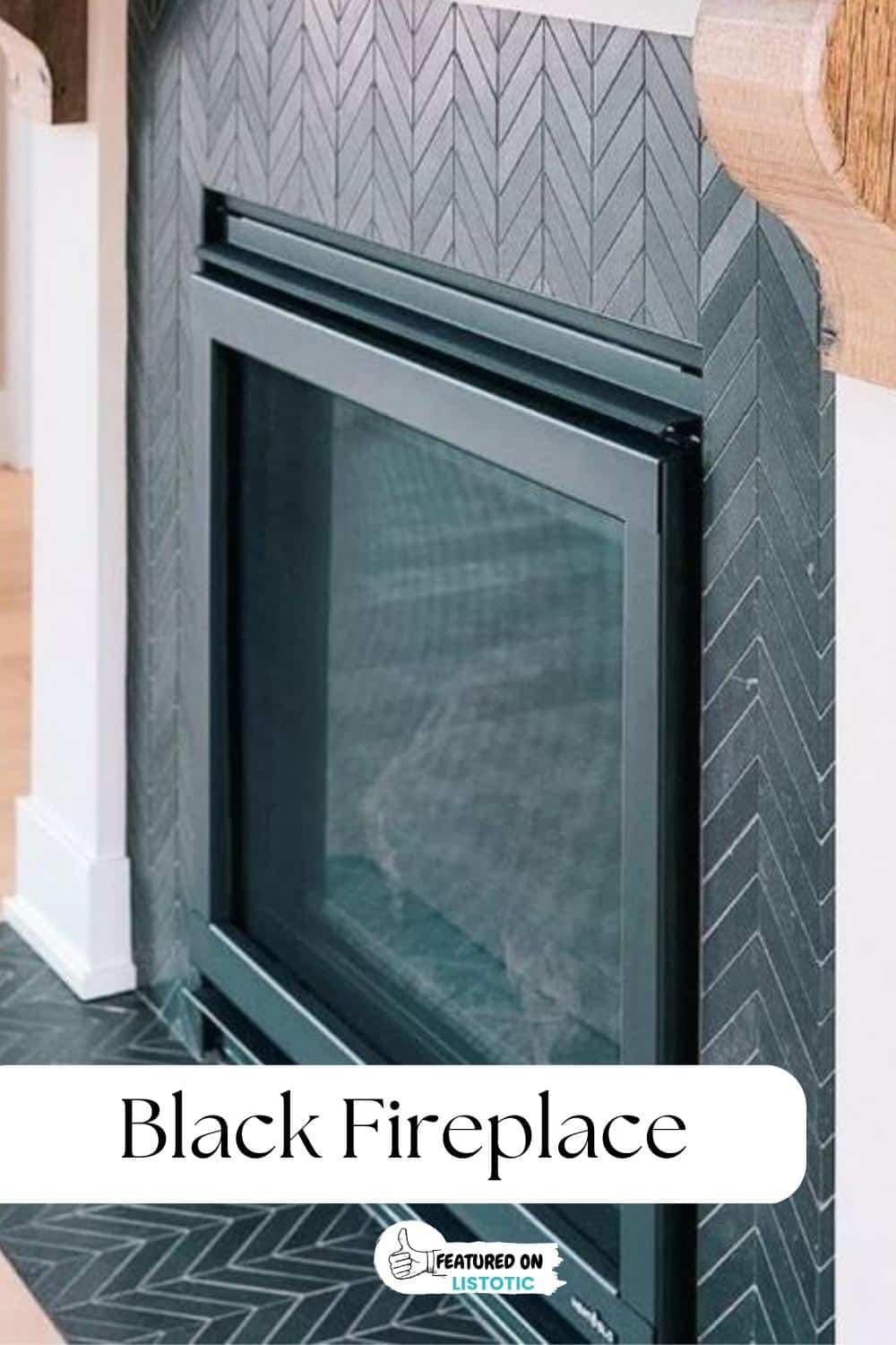 black herringbone tile fireplace with wood mantel