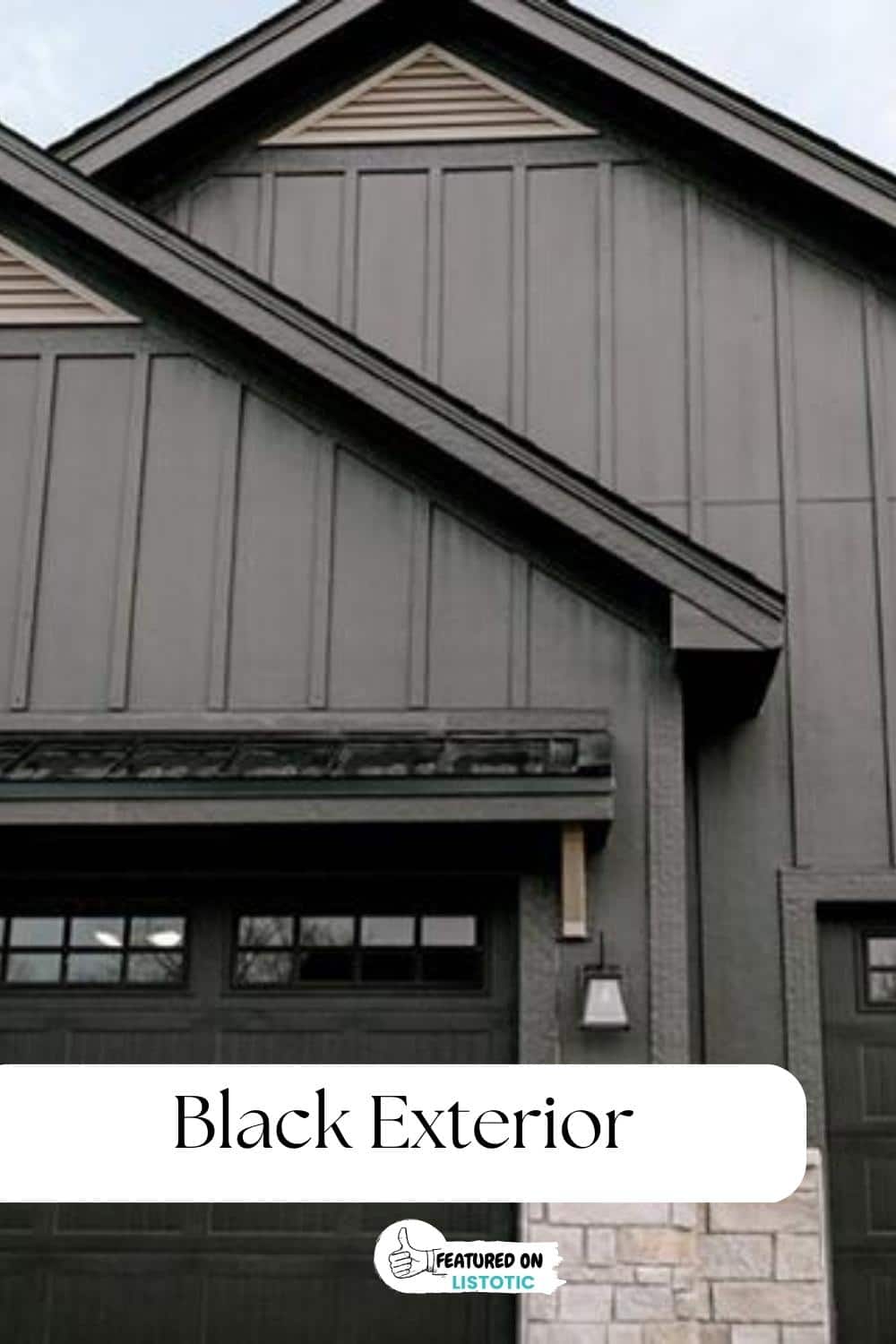 black exterior siding with light tan stone accent