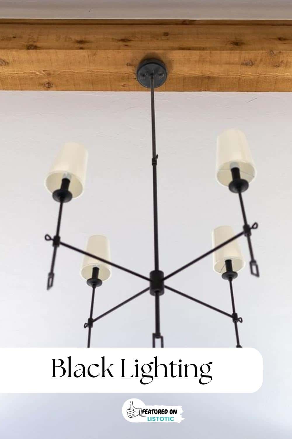 black chandelier with white lamp shades