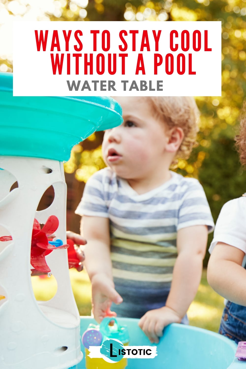 A toddler happily playing at a water table, splashing and pouring water from cups and toys on a sunny day in the backyard.