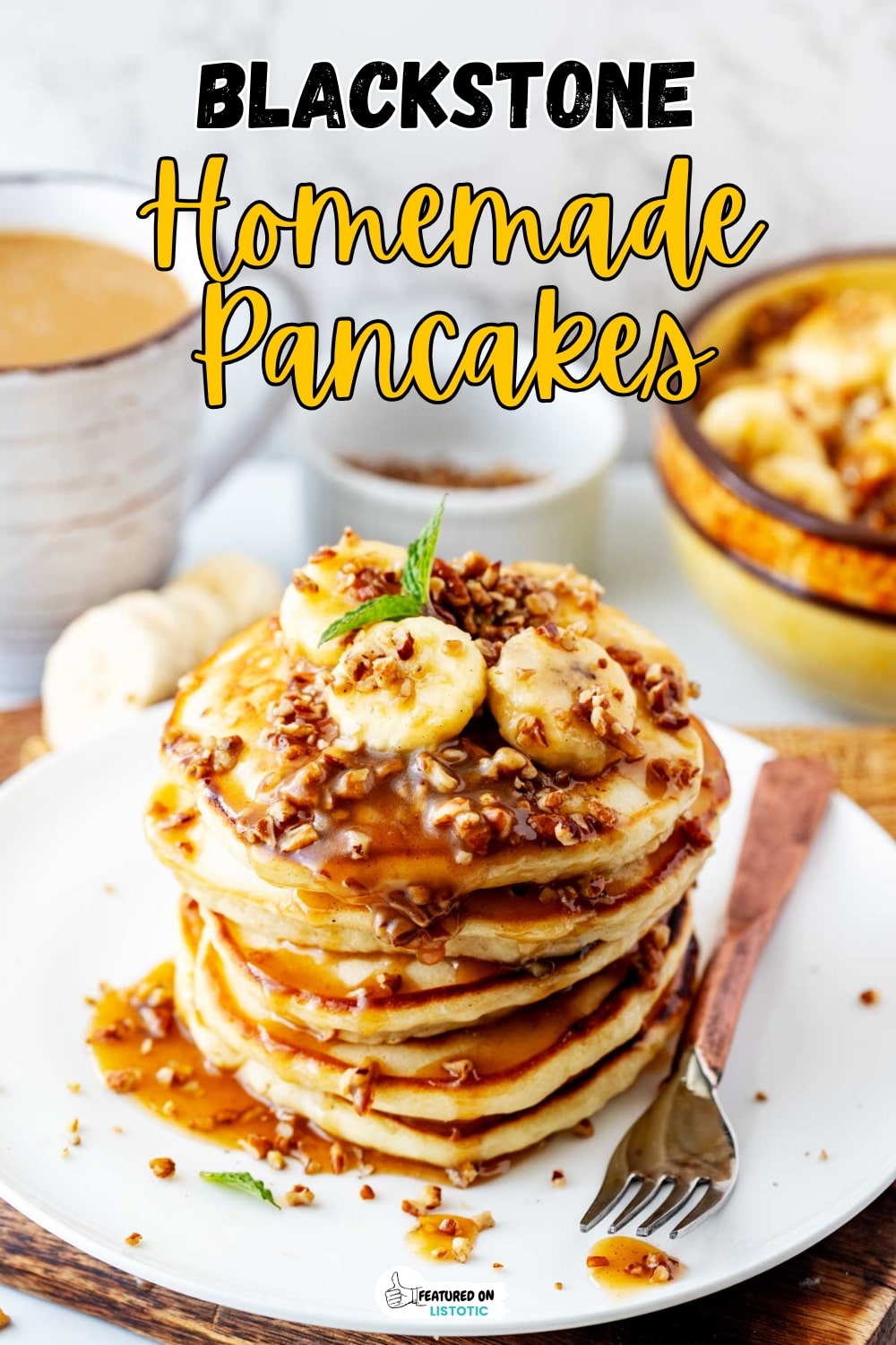 Fluffy Pancakes Cooking on Blackstone Griddle for a Crowd with bananas and nuts covered in syrup