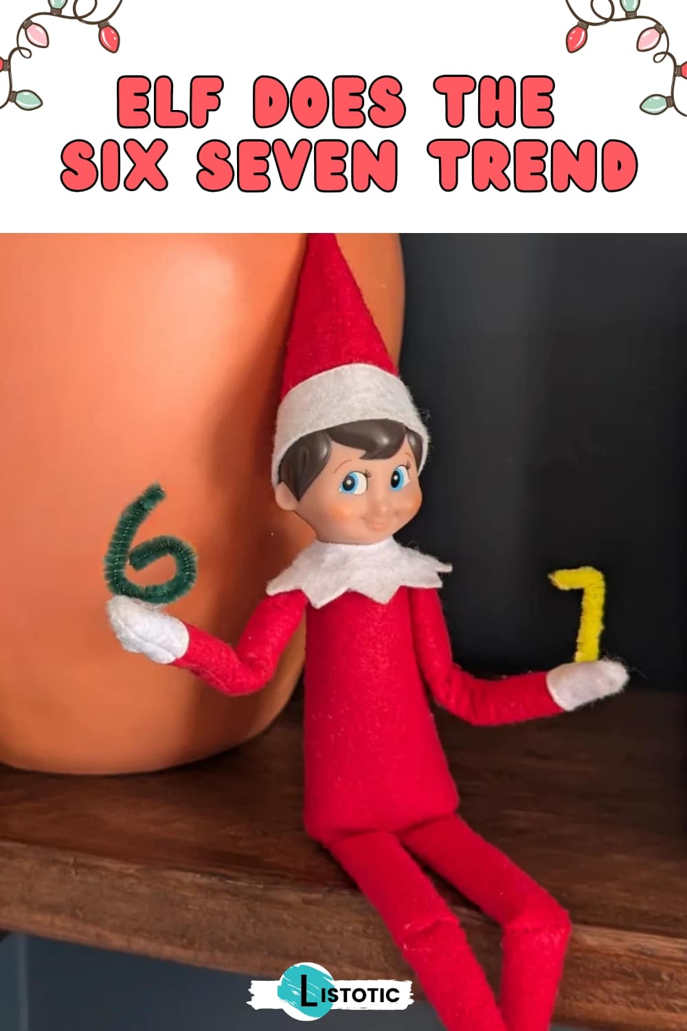 Elf on the Shelf holding a miniature SIXâSEVEN made out of pipe cleaners